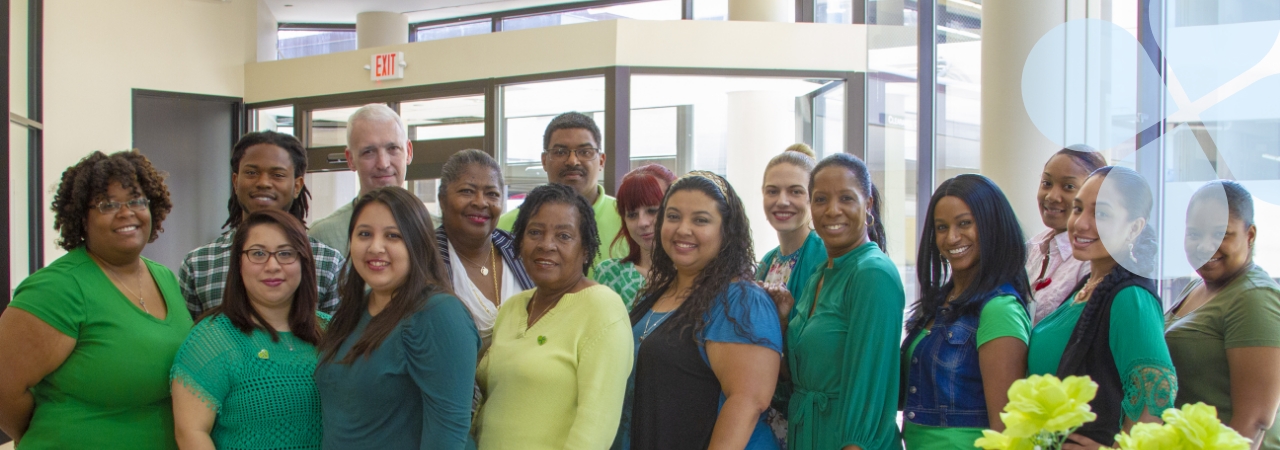 The Harris Center staff posing for a group shot in a Harris Center service location