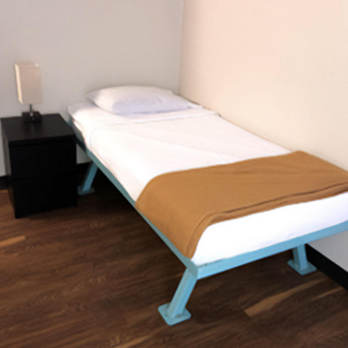 A twin-sized bed in a Harris Center diversion facility unit.