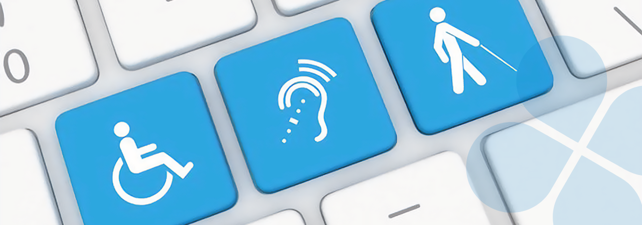 Closeup shot of computer keyboard with three blue keys side-by-side showing the International symbols for Mobility Impaired, Hearing Impaired, and Sight Impaired