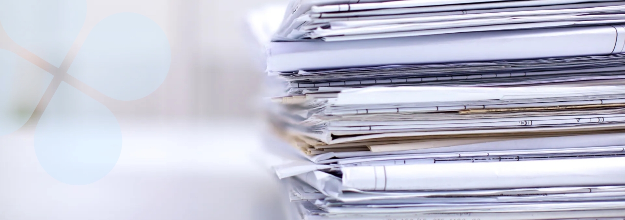 Soft focus closeup shot on the edge of a stack of paperwork