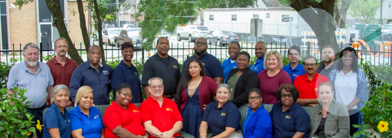 The Harris Center Juvenile Justice Services staff posing outside a service facility for a group shot