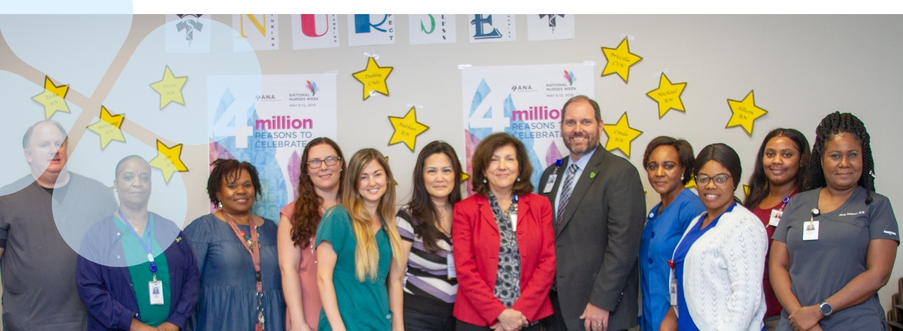 Group portrait of Behavioral Health Services staff with The Harris Center CEO, Wayne Young