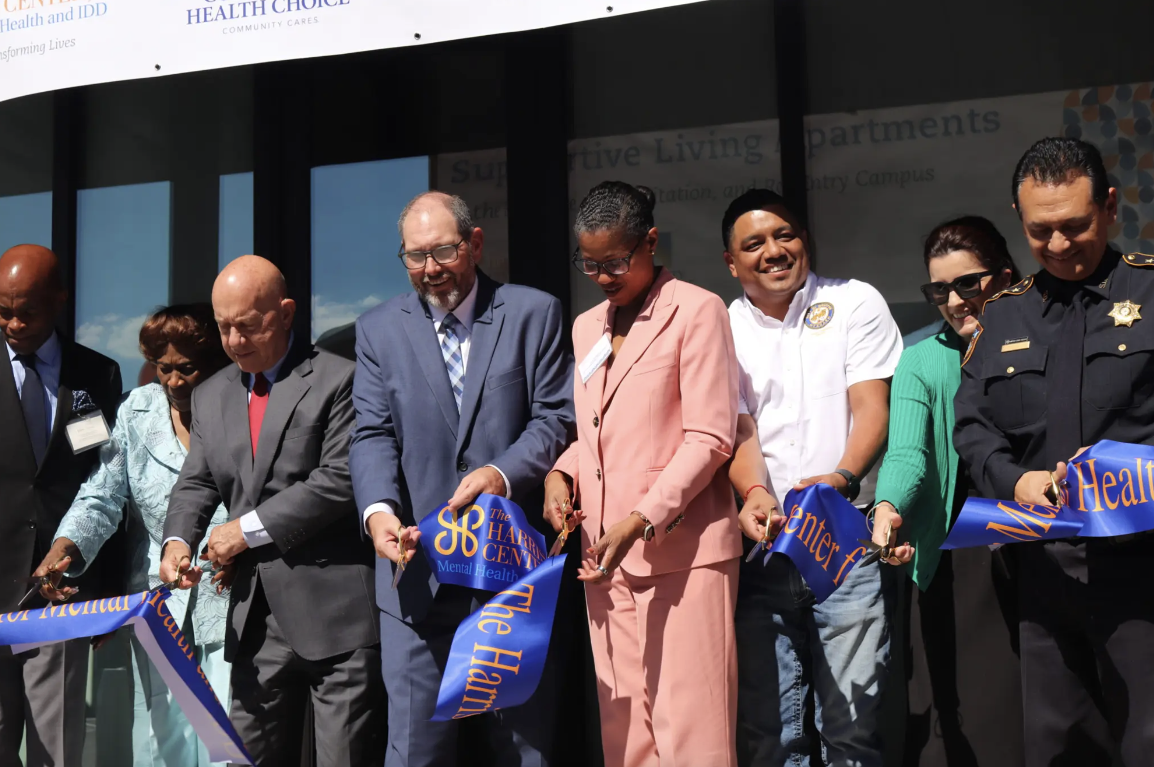 Officials with the city of Houston and Harris County celebrate the opening of a 26-unit apartment complex for people with mental health illnesses on Monday, Oct. 13, 2025.