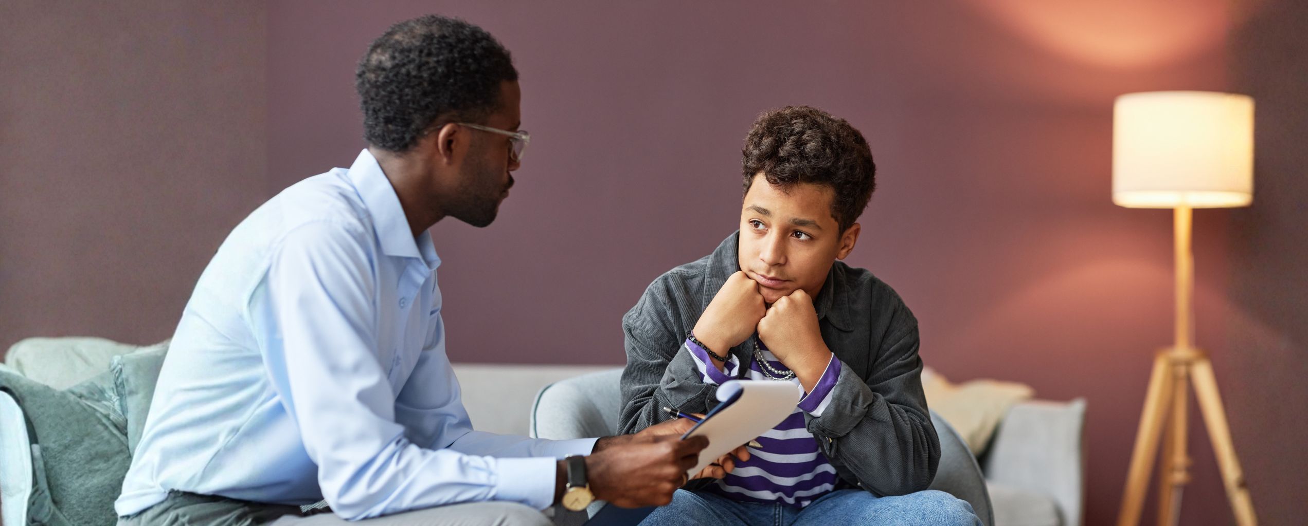 A counselor in a session with a teenager.