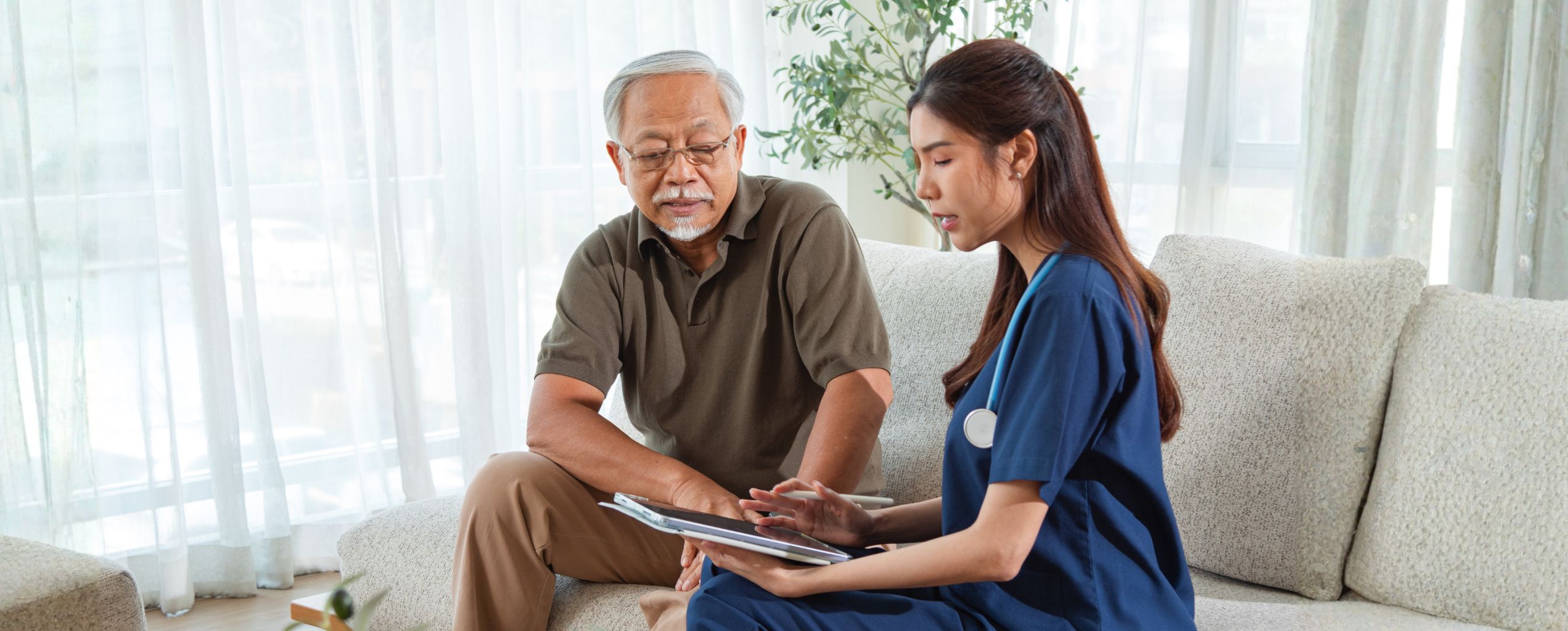 Nurse reviewing medical records with a patient.