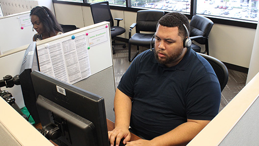 Crisis Services operators taking calls and assisting those in need