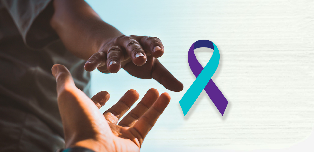 Two hands reaching for one another as in giving support, with the Suicide Prevention ribbon floating center of the screen.